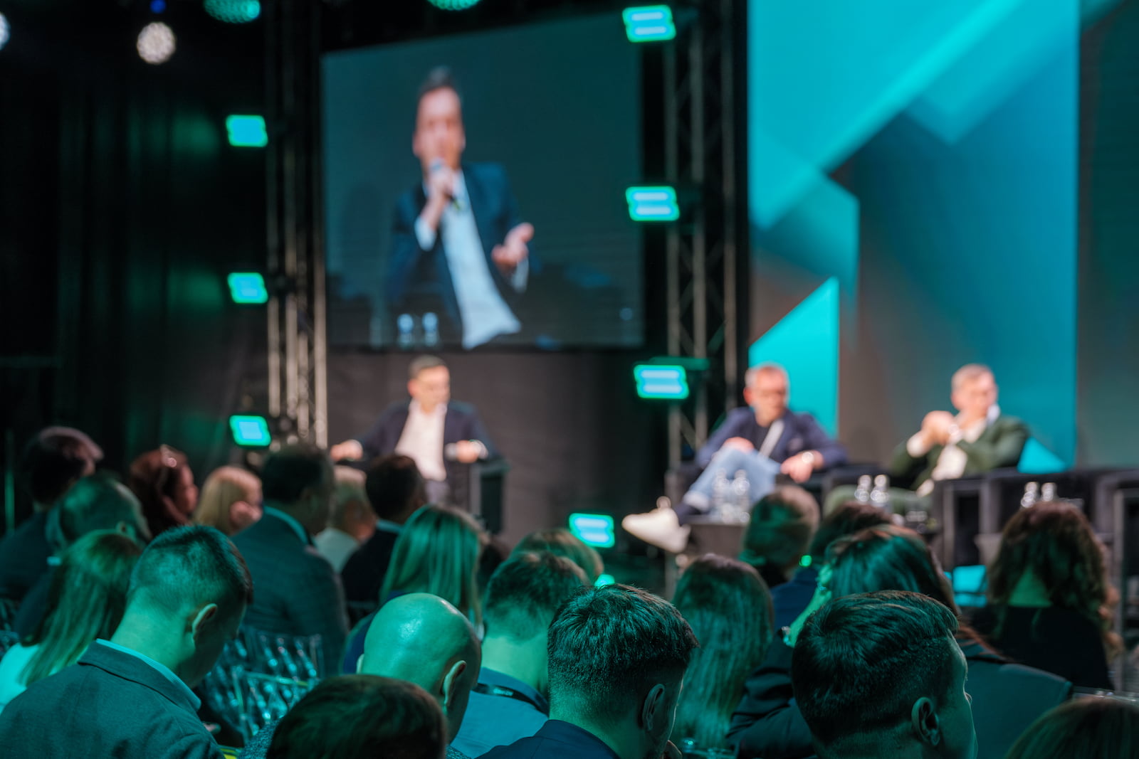 Audience watching a panel discussion at a corporate conference